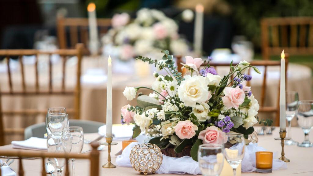 A photograph of flowers on a table.